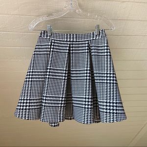 Plaid and houndstooth pleated skirt.